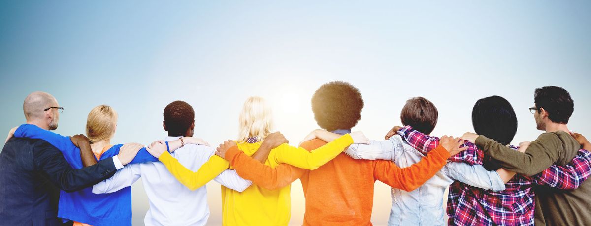 People with their arms around each other, supporting one another
